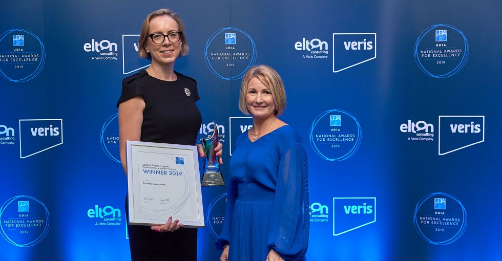 Tamara Rasmussen Kesree Jones in front of sponsor wall UDIA National and Frasers Property Women in Leadership Award 2019 