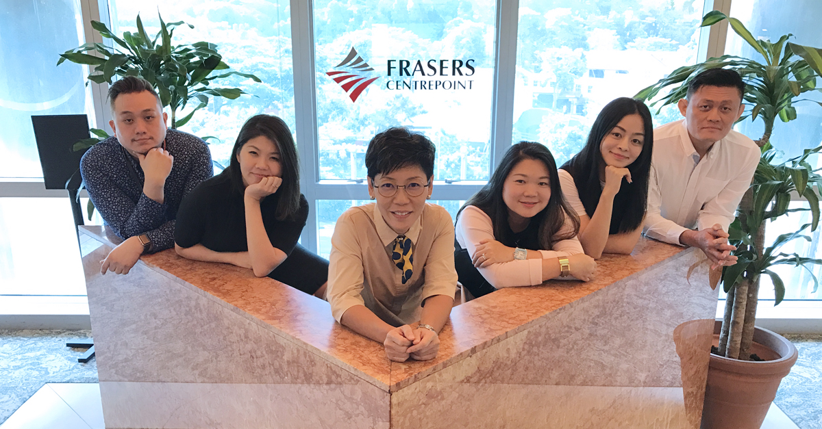 Angela (third from left) posing with her team comprising (from left) Christopher, Lucille, Cheryl, Christina and Sam.