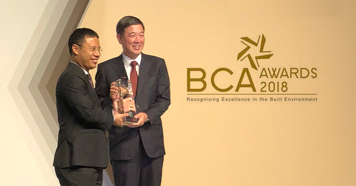 CEO, Christopher Tang, accepting the BCA Green Mark Champion Award  from Guest-of-Honour, Mr. Desmond Lee
