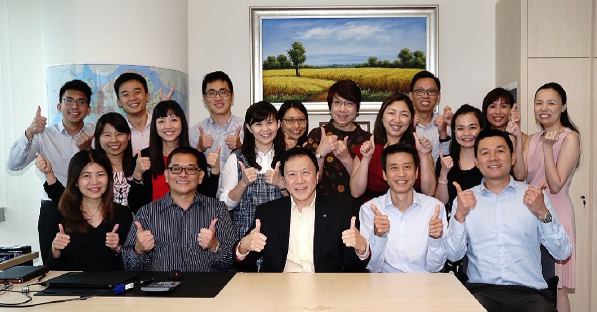 Dr Chew (middle) and his closely-knit team
