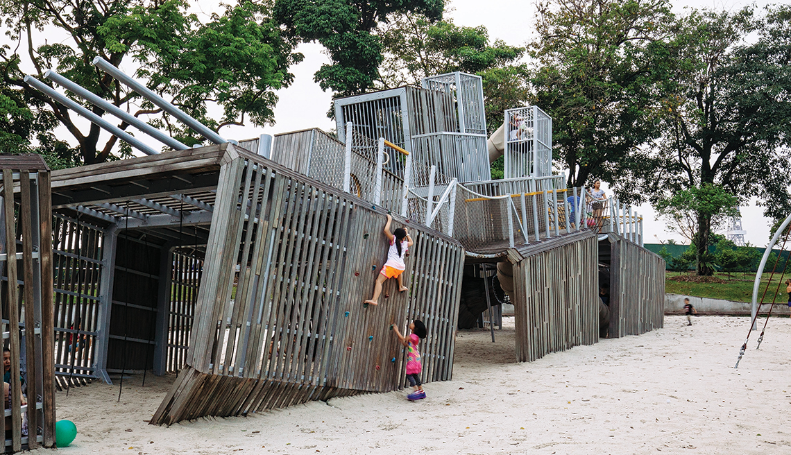 Sembawang Park’s large playground is modelled after a battleship with a rock climber, suspension bridge, caged tower and spiral tube slide.