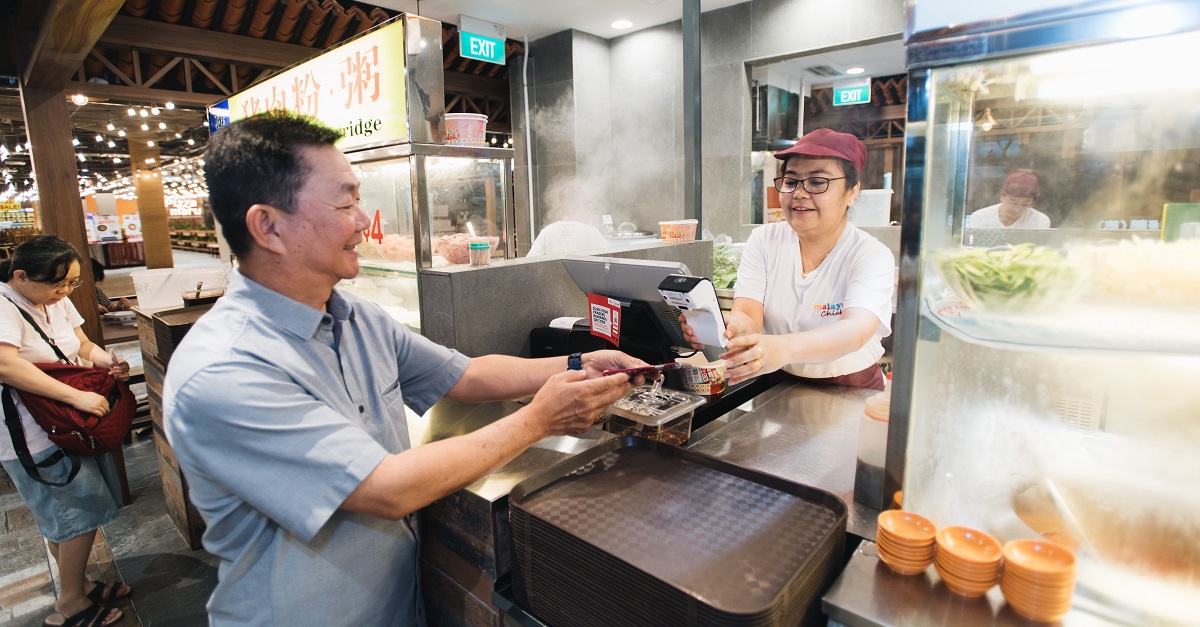 Mr. Philip Pang (left), CEO of Fei Siong Group testing out Makan Master at Northpoint City’s Malaysia Chiak!