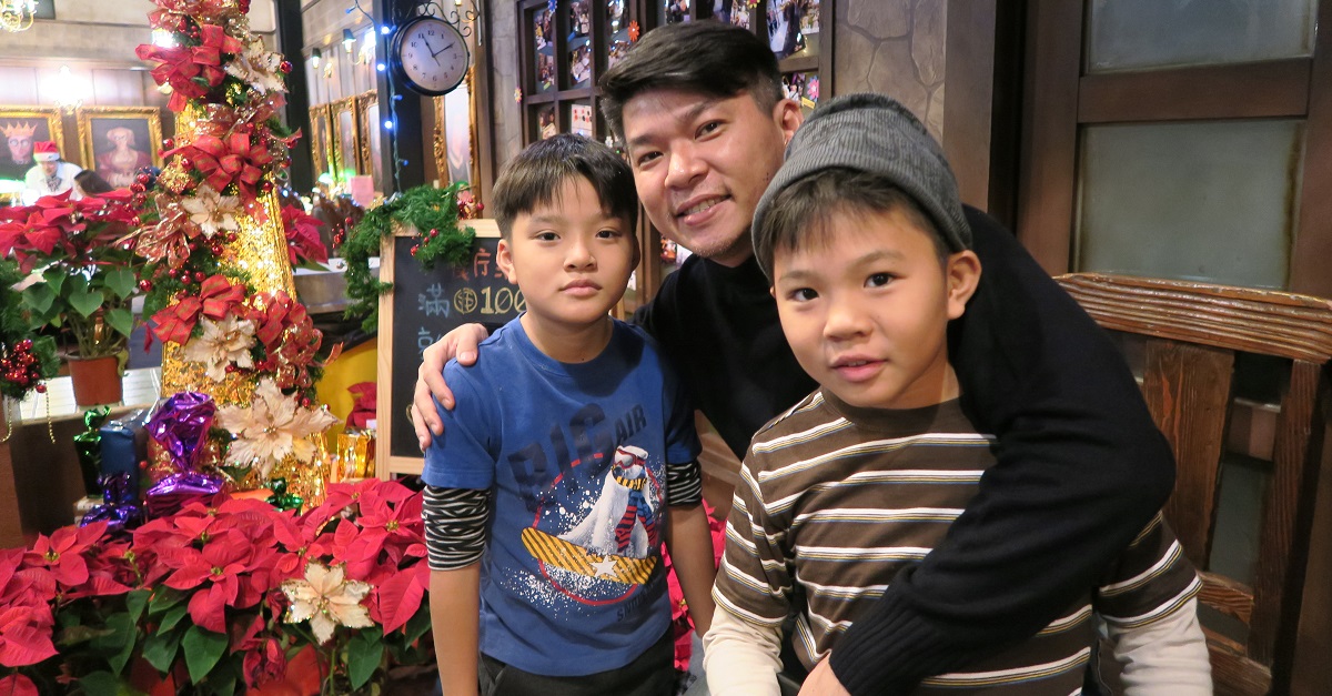 Chris Wu, with his sons who are now 13 and 11.