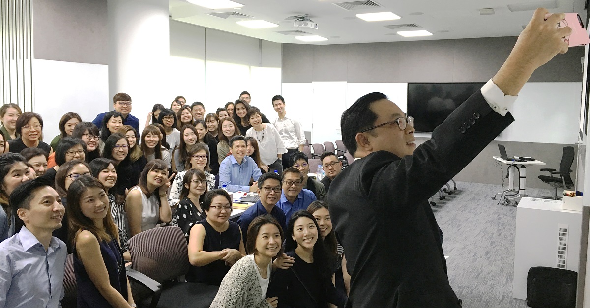 Mr Low Chee Wah attempting a wefie with the judges and participants.