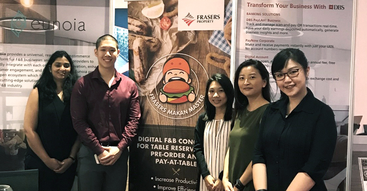 Our booth at Pleasures@RAS X DBS Disrupt Showcase with the marketing and communications department, promoting one of the Frasers Rewards App features, Makan Master