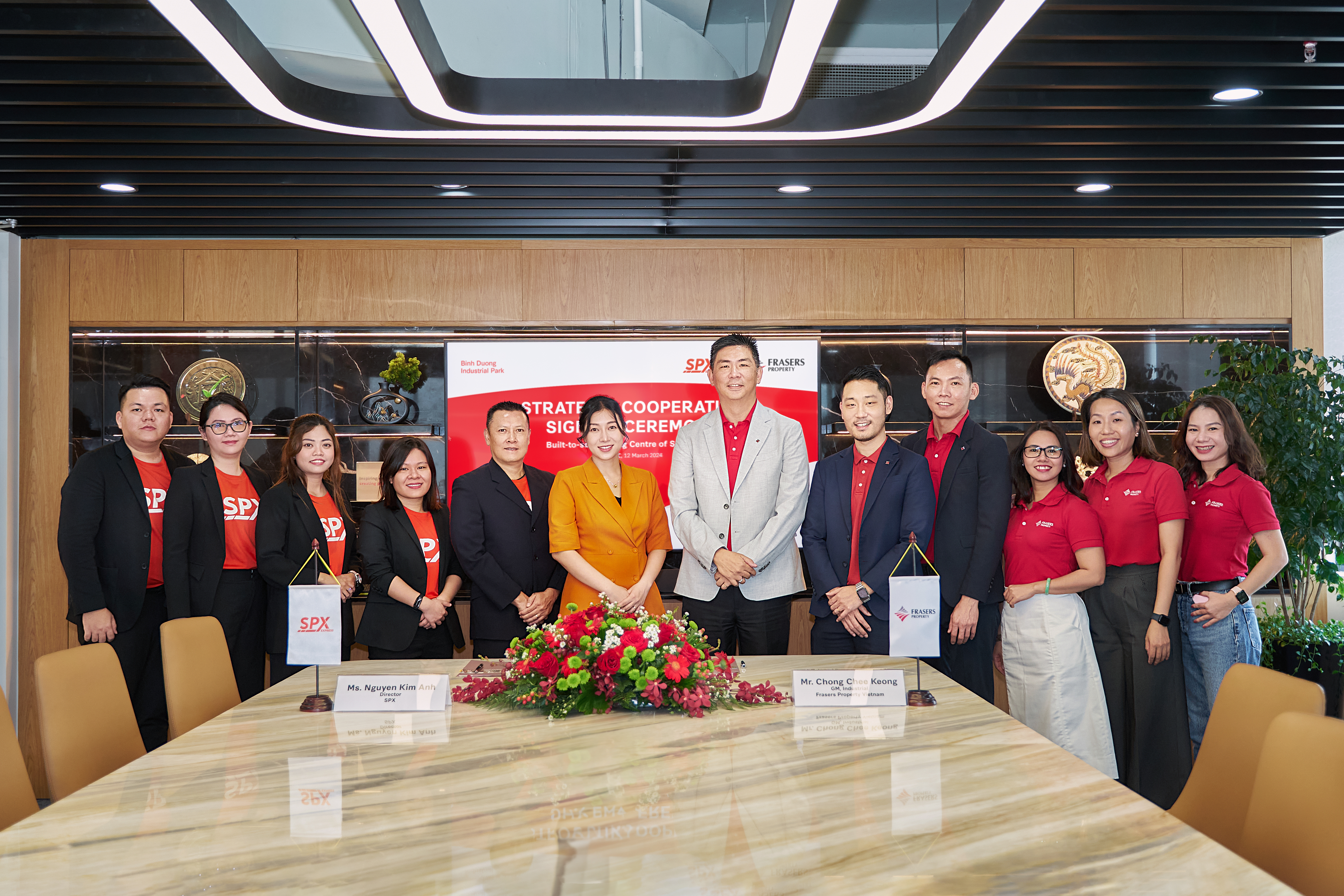 Group of people at a signing ceremony