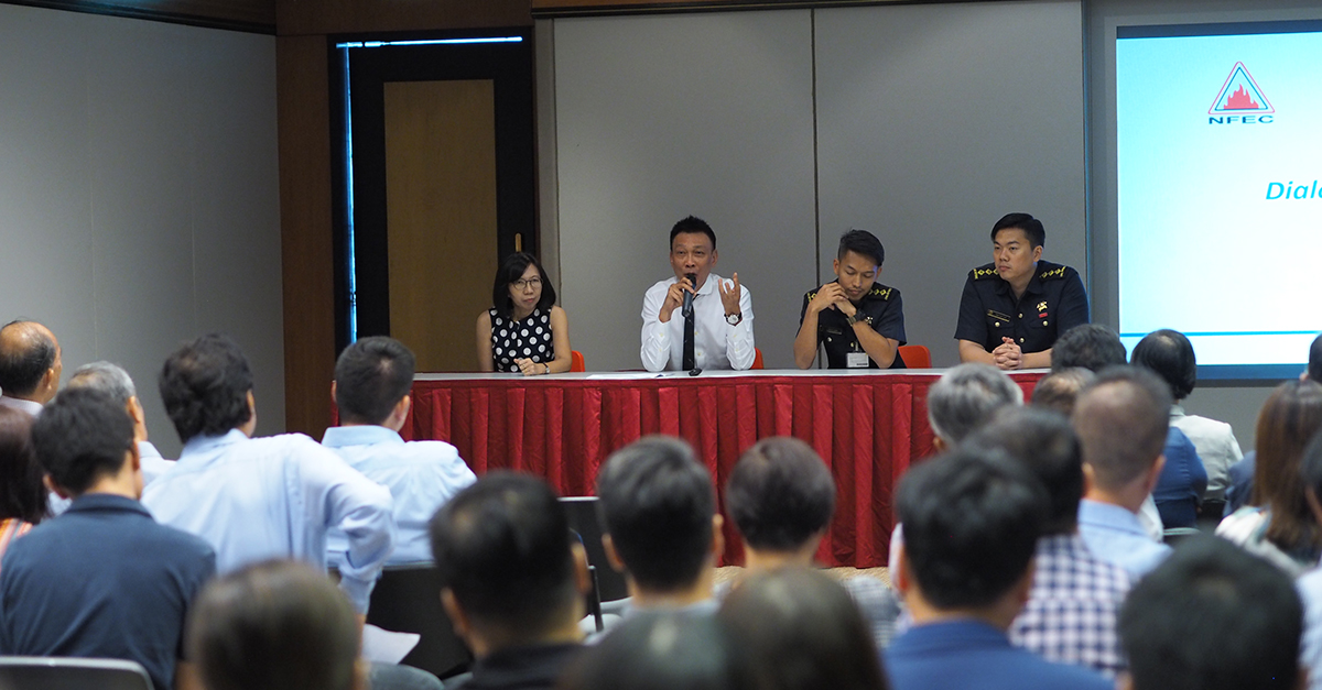From left: Ms Margaret Heng, Mr John Woo, Captain Muhammad Izwan, and Captain Ong Kok Ping speaking to a crowd of 128 people